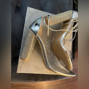 Size 8.5 silver heeled sandals new in box with tie Lala Ikai